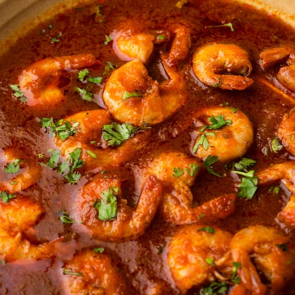 Close-up of Bombay Kitchen's Indian shrimp curry, garnished with fresh cilantro.